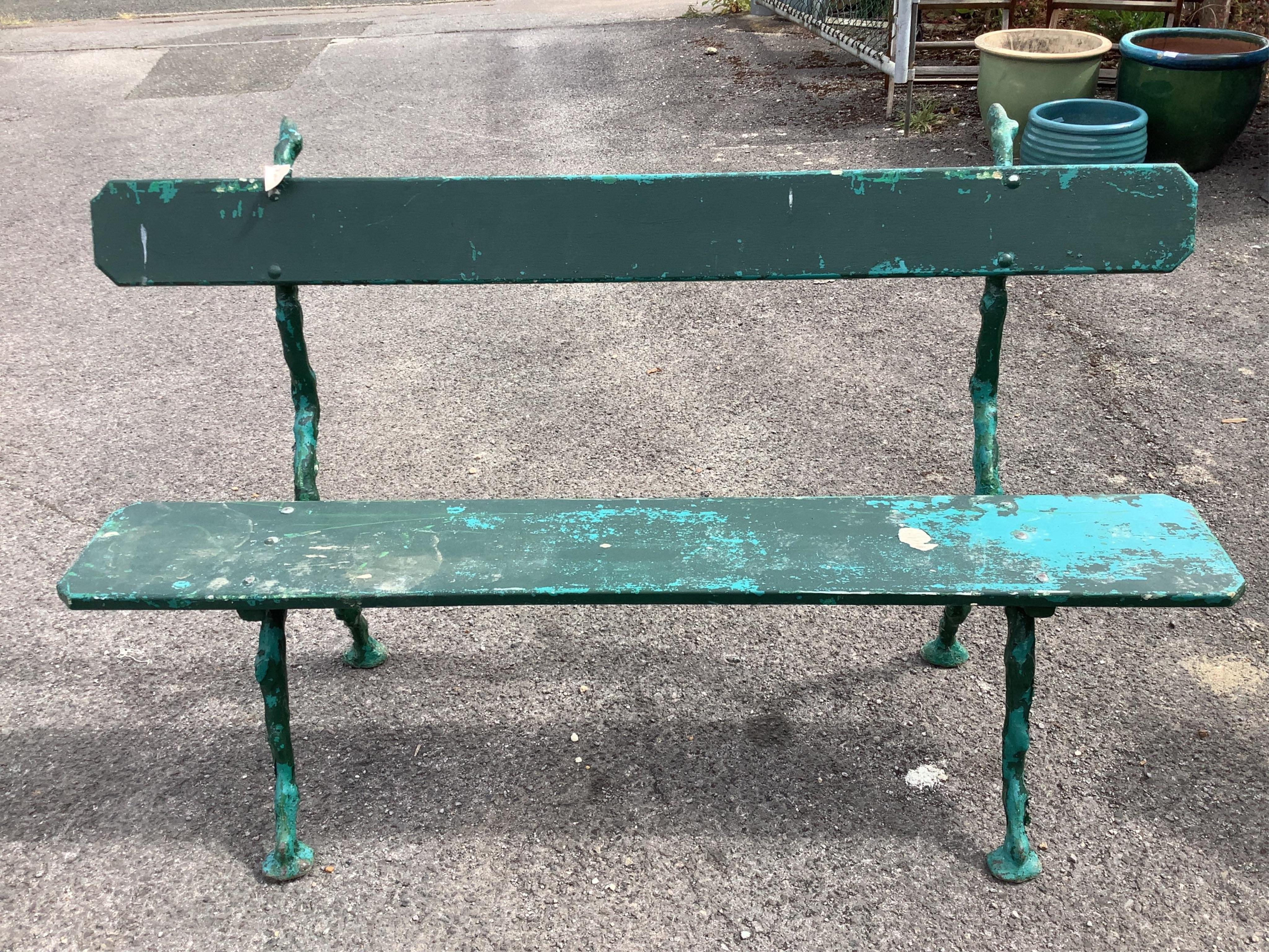 A pair of Coalbrookdale style painted cast metal garden benches, width 150cm, depth 50cm, height 91cm. Condition - fair